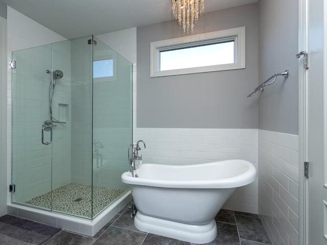 Finished bath with freestanding tub and glass shower, Quad Cities